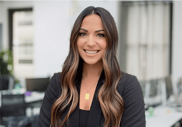 Headshot of Jessica Murphy with empty office environment in background.